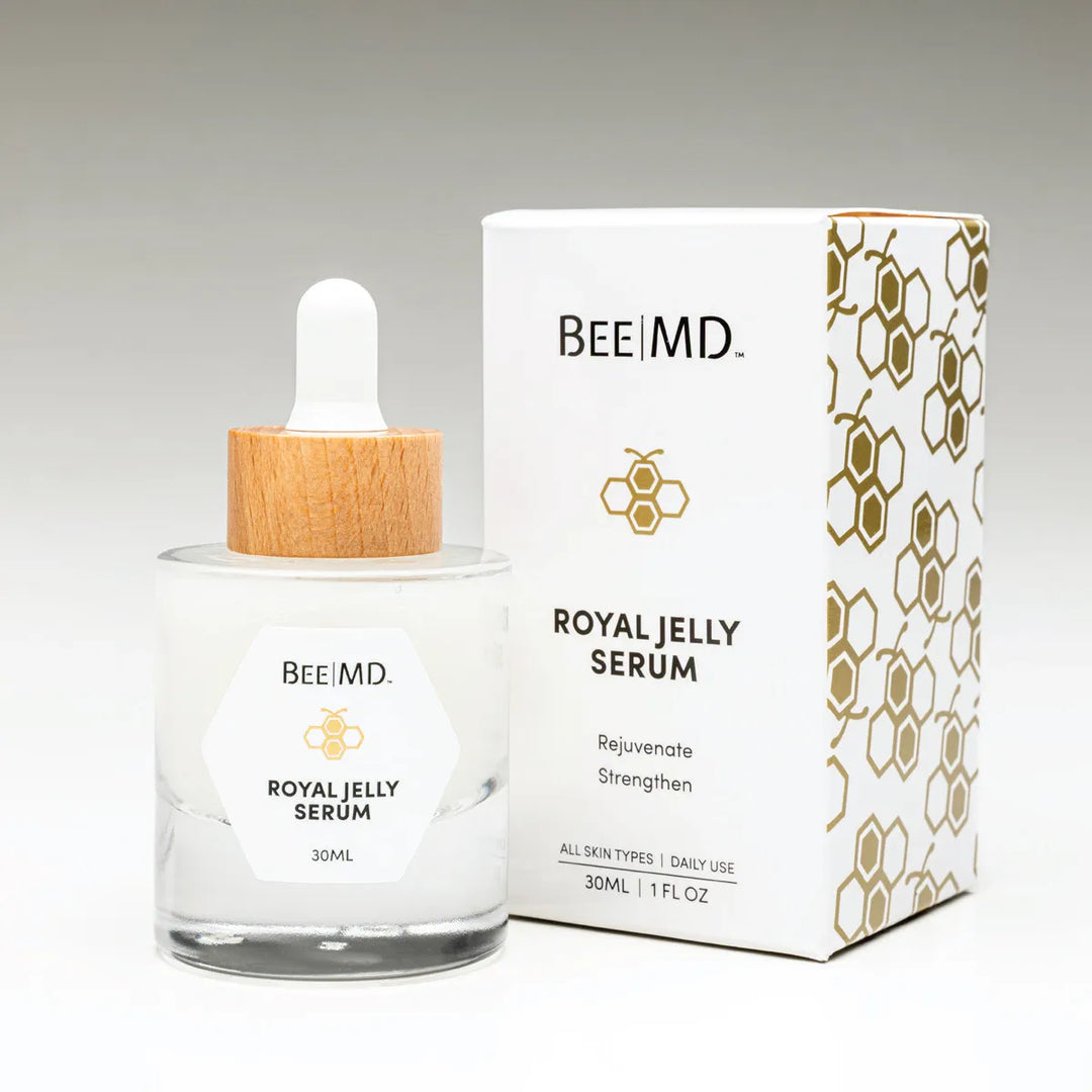 BEEMD Royal Jelly Serum bottle with matching packaging, displayed on a soft gradient background